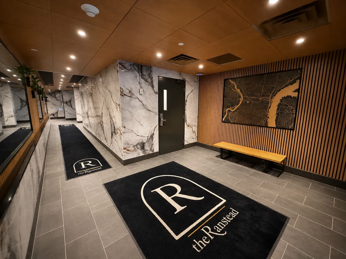 The Ranstead — lobby entry with Philadelphia map art and brand floor mats