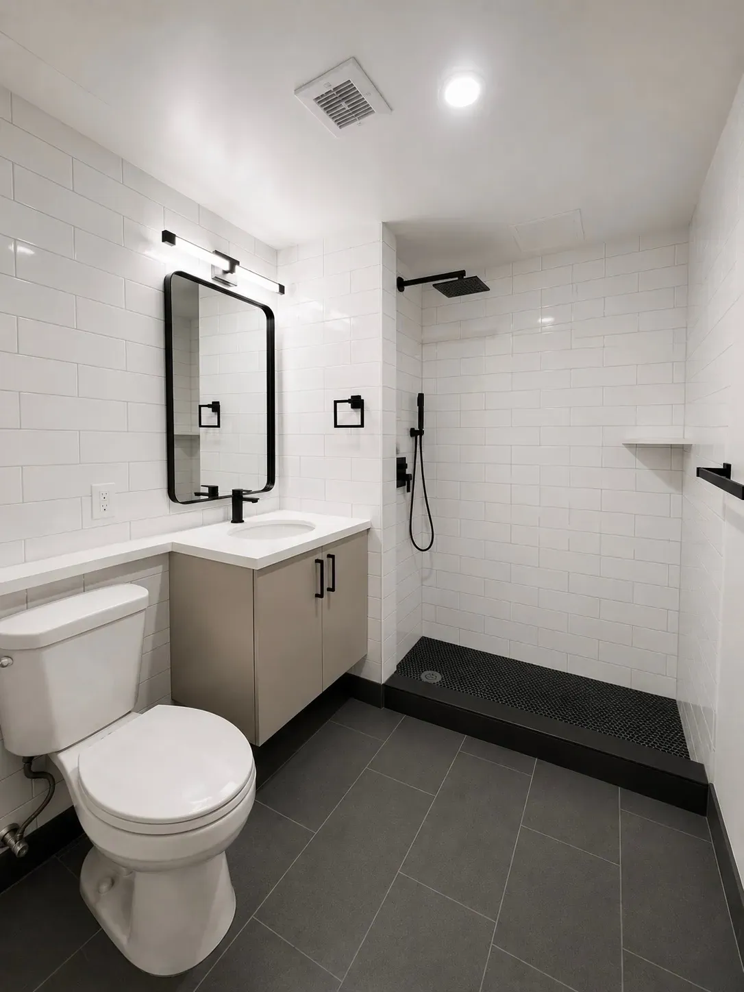 Studio bathroom with a light finish palette at The Ranstead